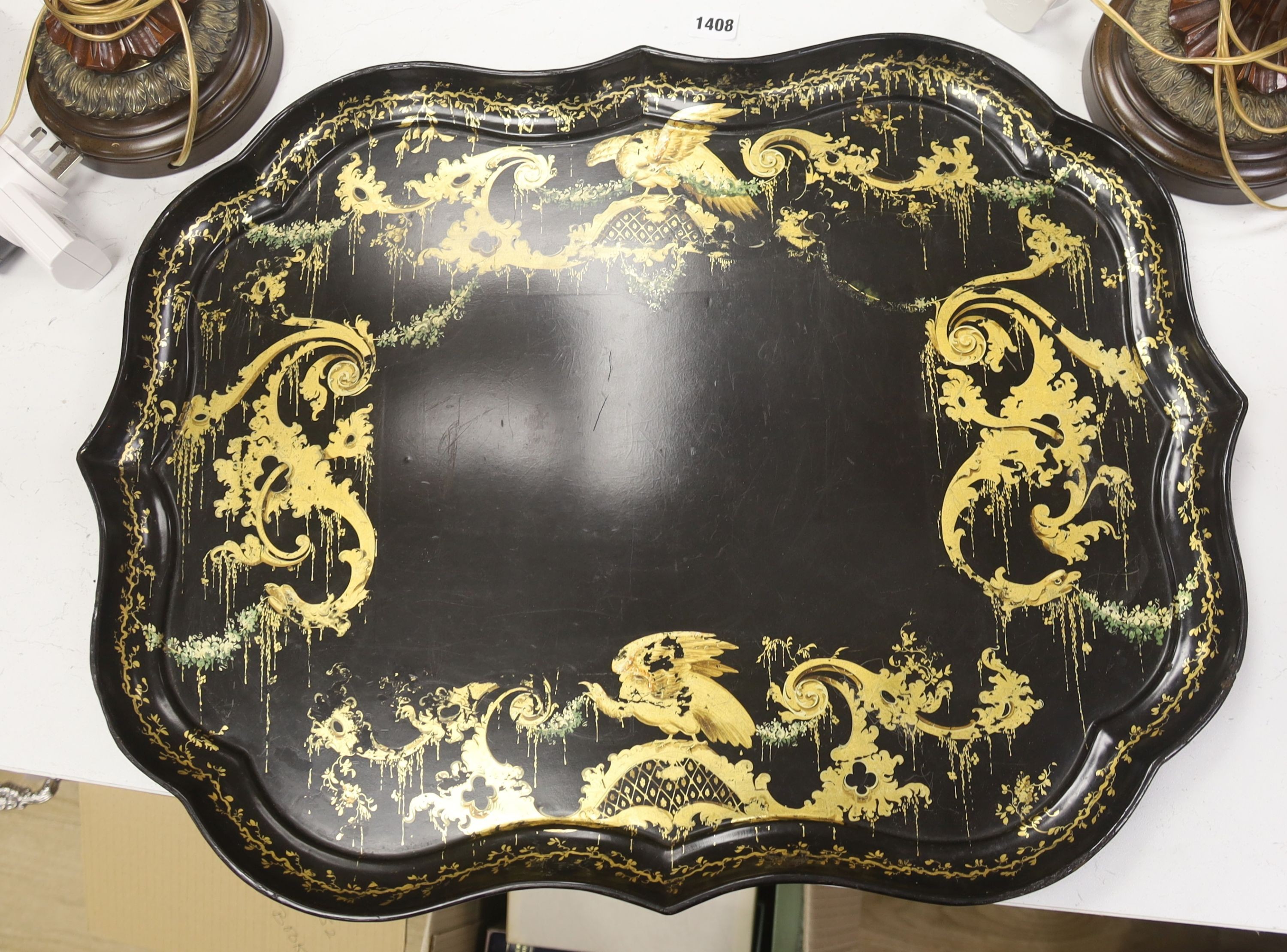 A large 19th century japanned papier mache tray, by B. Walton & Co., length 65cm